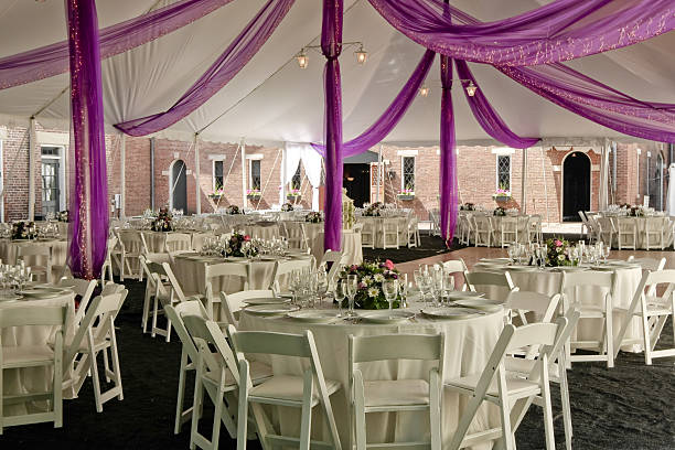 Outdoor wedding reception under a tent.